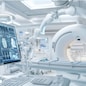 A state-of-the-art medical imaging room with a brain scan displayed on a monitor and advanced diagnostic equipment, showcasing high-tech healthcare technologies.