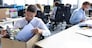 Sad dismissed worker are taking his office supplies with him from office.