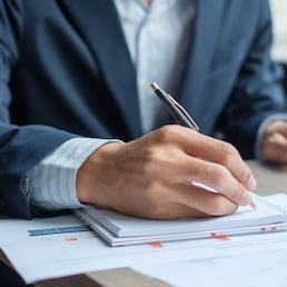 Businessman analysis maketing plan, Accountant calculate financial report, computer with graph chart.  Business, Finance and Accounting concepts