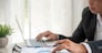 Asian businessman hands calculating number, graph, chart audit planning accountancy on business report. Asian professional Business man hands using calculator counting tax financial bill. Tax audit Finacial concept.