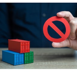 Shipping containers and prohibition symbol NO. Ban on import of goods. Sanctions and embargoes. Trade wars. Container shortage crisis. Blocking of cargo and blockade of trade routes.
