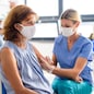 Old woman with face mask getting vaccinated, coronavirus, covid-19 and vaccination concept.