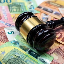rule of law and auctions with judge's gavel and euro banknotes. Crime concept