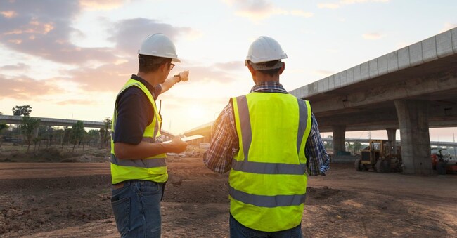The chief civil engineer is introducing inspection of a road or expressway construction project under the road to an intern. At the expressway construction site
