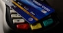 Credit cards placed on credit card swipes