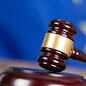 Judge hammer with European flag background