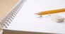 pencil, eraser and eraser leftovers on notebook