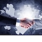 Close up of business handshake with puzzle elements at background