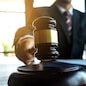 Lawyer working with contract papers on the table in office. consultant lawyer, attorney, court judge, concept.