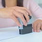 woman stamping a legal document