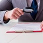 Man looking for errors and mistakes in report