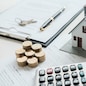 House model with real estate agent and customer discussing for contract to buy house, insurance or loan real estate background.