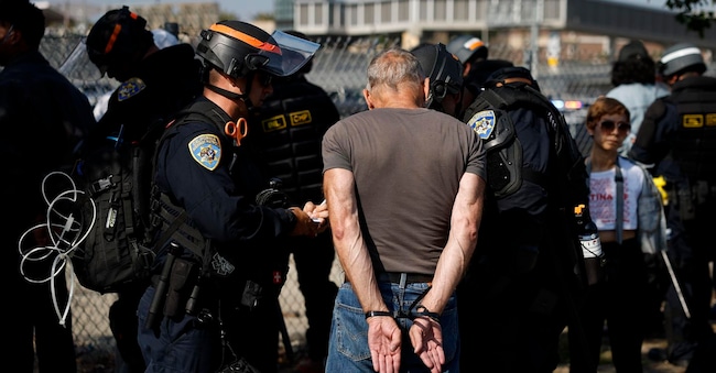 epa12169436 A protestor is detained during protests sparked by immigration raids in Los Angeles, California, USA, 10 June 2025. US President Donald Trump has deployed 2,000 National Guard troops, despite not receiving a request from the state of California for any additional assistance, following large protests against ongoing immigration enforcement raids in the Los Angeles area over the last few days. EPA/CAROLINE BREHMAN