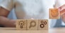 Woman hand holding dartboard above Gear, magnifying and Lightbulb icon block. business planning process, goal, strategy, target, mission, action, research, teamwork and idea concept