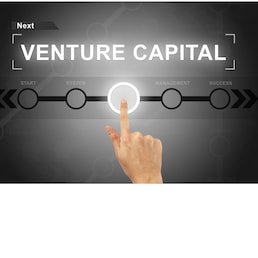 hand clicking venture capital button on a touch screen