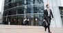 A businessman man goes to work in the office, in a business suit with a briefcase