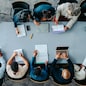 Top view of diverse business group in office meeting, collaborating and discussing around a large table.