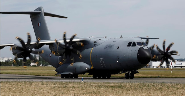 An Airbus A400M military plane carrying French President Emmanuel Macron lands on the tarmac at the 55th International Paris Airshow at Le Bourget Airport near Paris, France, Friday June 20, 2025. (Benoit Tessier/Pool via AP)