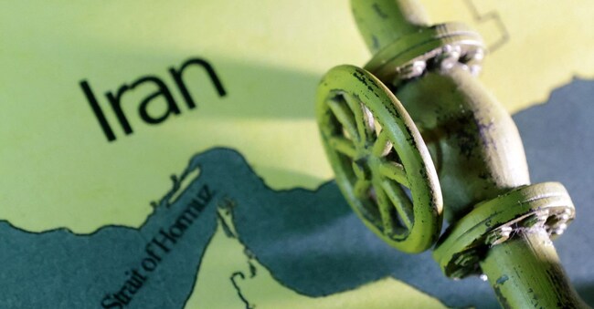 A map showing the Strait of Hormuz and Iran is seen behind a 3D printed oil pipeline in this illustration taken June 22, 2025. REUTERS/Dado Ruvic/Illustration