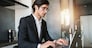 Businessman works at house with a laptop due to coronavirus quarantine.