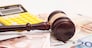 Judge gavel, euro banknotes and calculator
