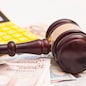 Judge gavel, euro banknotes and calculator