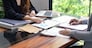 Businesswoman Accountant analyzing investment charts Invoice and pressing calculator buttons over documents. Accounting Bookkeeper Clerk Bank Advisor And Auditor.
