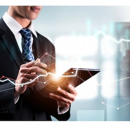 Businessman analyst working with digital finance business data graph showing technology of investment strategy for perceptive financial business decision. Digital economic analysis technology concept.