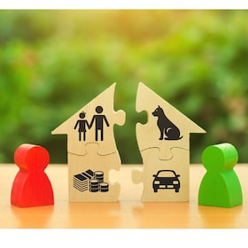 Two human figures divide the house among themselves. Divorce concept. Execution of the posthumous will. Disputes over division process of real estate and property between former spouses, relatives.