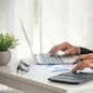 Asian businessman hands calculating number, graph, chart audit planning accountancy on business report. Asian professional Business man hands using calculator counting tax financial bill. Tax audit Finacial concept.