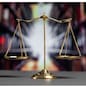 Shiny golden balanced scale in court library background as concept justice and fairness legal symbol. Scale balance for righteous and equality judgment by lawyer and attorney. equility
