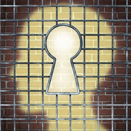 Creative freedom key with a human head light glowing on a brick wall through a prison cage opened with a keyhole shape as a business and mental health concept searching for innovative solutions to be set free for success.