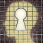 Creative freedom key with a human head light glowing on a brick wall through a prison cage opened with a keyhole shape as a business and mental health concept searching for innovative solutions to be set free for success.
