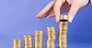 serie with columns of "gold" coins and fingers