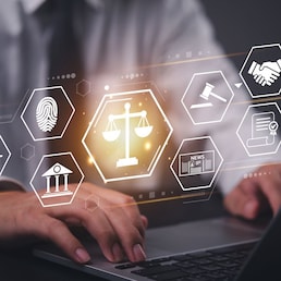 Businessman working laptop with a futuristic legal technology interface. Concept of law, justice, cybersecurity, digital transformation, and online legal services in business and corporate sectors.