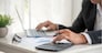Asian businessman hands calculating number, graph, chart audit planning accountancy on business report. Asian professional Business man hands using calculator counting tax financial bill. Tax audit Finacial concept.