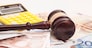 Judge gavel, euro banknotes and calculator