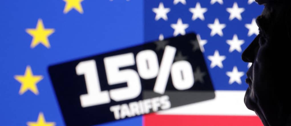 A 3D-printed miniature of U.S. President Donald Trump, U.S. and EU flags and words "15% tariffs" are seen in this illustration taken July 27, 2025. REUTERS/Dado Ruvic/Illustration
