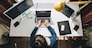 woman working on laptop at home. telework. freelance concept. overhead view
