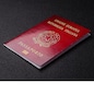 International passport of a citizen of Italy on dark concrete background, international travel