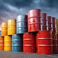 Metal oil barrels stacked in industrial yard, representing commodity storage, energy and petroleum sector