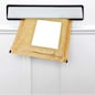 A padded envelope in the letterbox of a white front door, blank label for you to add your own name and address.