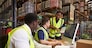 Team discussing warehouse logistics in an on-site office