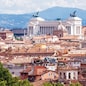 Aerial panoramic view of Rome, Italy. Beautiful Rome skyline in summer. Scenic panorama of Roma city from above. Scenery of historical area of Rome in sunlight. Horizontal banner with Rome for web.
