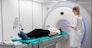 Female patient undergoing MRI - Magnetic resonance imaging in Hospital. Medical Equipment and Health Care.