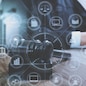 justice and law concept.Male judge in a courtroom with the gavel,working with digital tablet computer docking keyboard on wood table,eyeglass,virtual interface graphic icons diagram