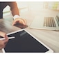 businessman working with blank screen digital tablet computer and smart phone and laptop computer on wooden desk as concept