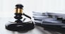 Black wooden gavel hammer and legal document in empty law firm or lawyer office background as justice and legal system for lawyer and judge, Legal authority and fairness in trials concept. equility