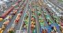 (FILES) This aerial view shows shipping containers stacked at the Port of Baltimore on April 10, 2025, in Baltimore, Maryland. US President Donald Trump ordered the reimposition of tariffs on dozens of trading partners on July 31, 2025 -- his cornerstone strategy for reshaping global trade to benefit the US economy. However in a minor reprieve, the White House said the measures will take effect in a week, not on August 1 as previously expected. (Photo by Jim WATSON / AFP)