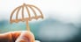 Man holding an umbrella symbol, rainy day, Concept for insurance, policies, family life insurance